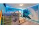 Nautical-themed bedroom with bunk beds, mermaid decorations and ocean-themed wall art at 9004 Sunshine Ridge Loop, Kissimmee, FL 34747