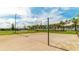 The sandy volleyball court offers a beach-like setting for a fun and active outdoor experience at 9004 Sunshine Ridge Loop, Kissimmee, FL 34747