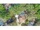 Aerial view of a home featuring a screened-in pool, lush landscaping, and mature trees at 1204 Swan St, Winter Springs, FL 32708