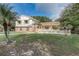 Charming two-story home with brick accents, a well-manicured lawn, and mature trees at 1204 Swan St, Winter Springs, FL 32708