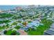An aerial view of a lovely coastal home featuring lush landscaping, a private pool, and water access at 3168 S Peninsula Dr, Daytona Beach, FL 32118
