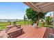 Inviting back porch with a picnic table and rocking chairs, offering stunning water views and a serene outdoor space at 3168 S Peninsula Dr, Daytona Beach, FL 32118