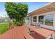 Spacious back porch with a wooden picnic table and water views, ideal for outdoor dining and relaxation at 3168 S Peninsula Dr, Daytona Beach, FL 32118