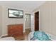 Cozy bedroom with hardwood floors, closet, and TV, providing a comfortable and private space at 3168 S Peninsula Dr, Daytona Beach, FL 32118