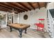 Entertaining game room featuring a pool table, popcorn machine, and access to outdoor living at 3168 S Peninsula Dr, Daytona Beach, FL 32118