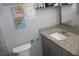 A gray vanity and countertop create a clean look in this bathroom at 319 Wilmer Ave, Orlando, FL 32811