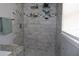 The tiling in this walk-in shower is stylish and sure to stand out at 319 Wilmer Ave, Orlando, FL 32811