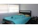 This bedroom features natural light from the window and a comfortable-looking bed at 319 Wilmer Ave, Orlando, FL 32811