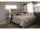 This bedroom has wood floors and curtains to diffuse the natural light from outside at 319 Wilmer Ave, Orlando, FL 32811