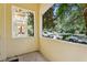 Balcony view showcasing the front street, mature trees, and a glimpse of neighborhood charm at 8639 Lower Villagewalk Cir, Orlando, FL 32827