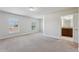 Well-lit bedroom with two windows and access to an en-suite bathroom, offering comfort and privacy at 8639 Lower Villagewalk Cir, Orlando, FL 32827