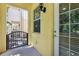 Covered entrance with decorative gate and sidelight by the front door at 8639 Lower Villagewalk Cir, Orlando, FL 32827