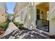 Exterior pathway featuring brick pavers, neat landscaping, and an inviting gated entry at 8639 Lower Villagewalk Cir, Orlando, FL 32827