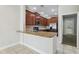 Kitchen boasts stainless steel appliances, granite countertops, and ample cabinet space at 8639 Lower Villagewalk Cir, Orlando, FL 32827