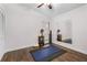 Bright bedroom with hardwood floors, mirrored wall, and a ceiling fan at 1 W Village Dr, Oviedo, FL 32765