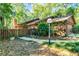 This well-kept home has a cozy curb appeal with its manicured landscaping and private, fenced-in yard at 1 W Village Dr, Oviedo, FL 32765