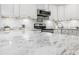 Kitchen with marble countertops and stainless steel appliances at 1 W Village Dr, Oviedo, FL 32765