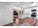 Bright kitchen with white cabinets and stainless appliances, open to other living areas at 1 W Village Dr, Oviedo, FL 32765