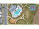 An aerial view of resort-style amenities featuring a pool, playground, basketball court, and lush landscaping at 10684 Words Dr, Winter Garden, FL 34787