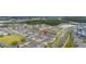 An aerial view showing the neighborhood's well-manicured lawns and landscaping and community lakes at 10684 Words Dr, Winter Garden, FL 34787