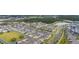 A neighborhood aerial view showcasing well-manicured lawns, landscaping, and community lakes at 10684 Words Dr, Winter Garden, FL 34787