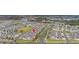 An aerial view featuring well-manicured lawns, landscaping, and community lakes at 10684 Words Dr, Winter Garden, FL 34787