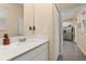 Well-lit bathroom featuring a white vanity with a quartz countertop and stainless steel faucet at 10684 Words Dr, Winter Garden, FL 34787