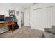 Well-lit bedroom featuring a closet and neutral carpet at 10684 Words Dr, Winter Garden, FL 34787