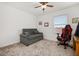 Cozy bedroom with a ceiling fan, sofa, and a comfortable gaming chair at 10684 Words Dr, Winter Garden, FL 34787