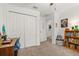Bedroom featuring neutral carpet, a closet, and a doorway leading to a bathroom at 10684 Words Dr, Winter Garden, FL 34787