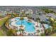 Aerial shot showcasing the luxurious community pool area with ample seating and lush landscaping at 10684 Words Dr, Winter Garden, FL 34787