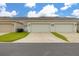 Attached garages offering convenient parking and storage in this well-maintained community at 10684 Words Dr, Winter Garden, FL 34787