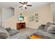Comfortable living room with plush seating, a ceiling fan, and a mounted television at 10684 Words Dr, Winter Garden, FL 34787