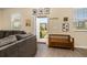 Comfortable living room with natural light, wood-look floors, and stylish decor at 10684 Words Dr, Winter Garden, FL 34787