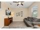Inviting living room with comfortable seating, a ceiling fan, and a neutral color scheme at 10684 Words Dr, Winter Garden, FL 34787