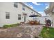 Outdoor patio with a wooden table and chairs and an outdoor grill at 10684 Words Dr, Winter Garden, FL 34787