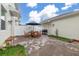Paved patio area featuring a wooden table and chairs and grill at 10684 Words Dr, Winter Garden, FL 34787