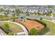 Community playground featuring slides, a trampoline, and climbing structures at 10684 Words Dr, Winter Garden, FL 34787
