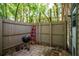 Enclosed backyard with charcoal grill, hardscape and pull-up bar at 1210 Baypoint Ct, Longwood, FL 32750