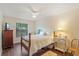 Comfortable bedroom with ceiling fan, neutral colors, and hardwood flooring at 1210 Baypoint Ct, Longwood, FL 32750