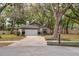 Charming single-story home featuring a well-maintained lawn, driveway, and two-car garage at 1210 Baypoint Ct, Longwood, FL 32750