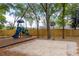 Outdoor playground with a basketball court, slide, and swings at 1210 Baypoint Ct, Longwood, FL 32750