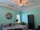 Cozy bedroom featuring a comfortable bed, stylish accents, and calming colors at 12238 Still Meadow Dr, Clermont, FL 34711