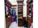 Spacious walk-in closet with custom shelving and ample storage space at 12238 Still Meadow Dr, Clermont, FL 34711