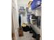 Walk-in closet with shelving filled with storage bins and household items at 12238 Still Meadow Dr, Clermont, FL 34711