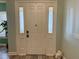 Front door featuring sidelights and decorative glass at 12238 Still Meadow Dr, Clermont, FL 34711