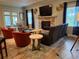 Inviting living room featuring fireplace, comfortable seating, and natural light at 12238 Still Meadow Dr, Clermont, FL 34711