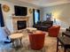 Comfortable living room with fireplace, TV, plush seating and stylish decor at 12238 Still Meadow Dr, Clermont, FL 34711