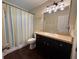 Bathroom featuring a vanity, mirror, shower with a curtain, and neutral colors, perfect for daily routines at 1528 Baltimore Dr, Orlando, FL 32810