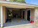 This carport features ample parking space with multiple doors to storage, creating functional outdoor space at 1528 Baltimore Dr, Orlando, FL 32810